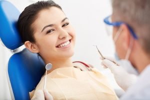 Patient smile while having treatment by dentist mosman